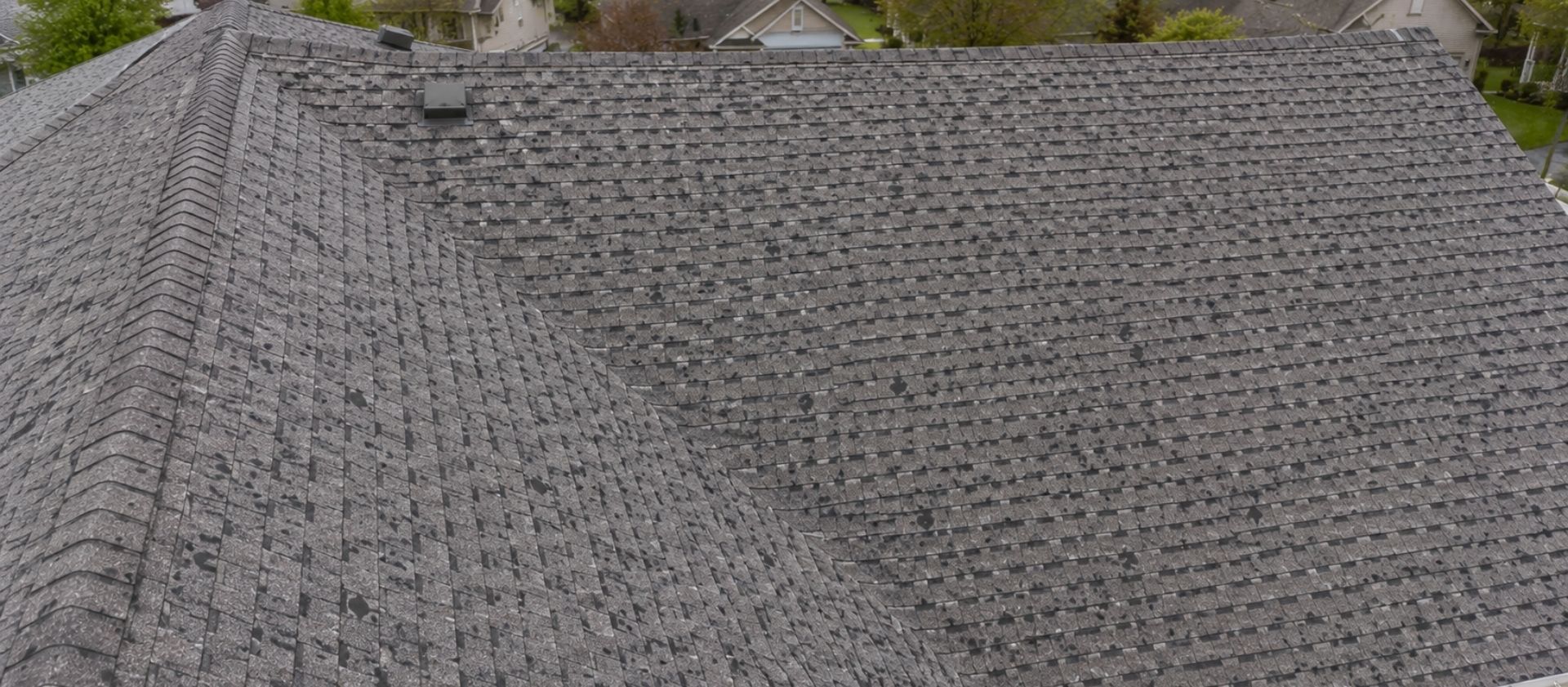 Hidden hail damage signs on Illinois asphalt shingle roof after spring storm